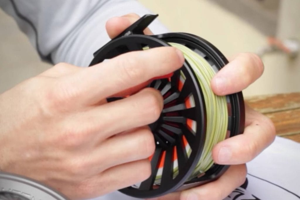 How do you measure the drag settings on a reel